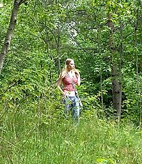 Blonde cutie empties her bladder in the forest