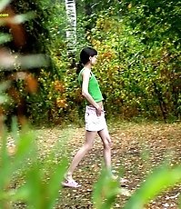 Little babe takes a leak in the nearby bushes
