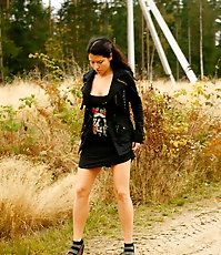 Beautiful brunette filmed pissing behind the bush