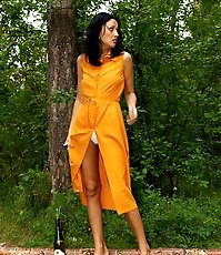 Sexy brunette peeing in the park road