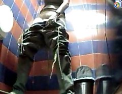 Peek at girl taking her baggy pants off and peeing