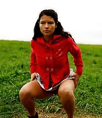 Girlie feeling cold takes a quick leak on a field