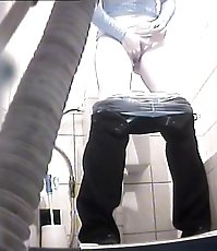 Voyeur peeps after two babes in public toilet