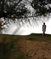 Cute babe goes out commando and pisses in the woods