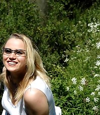 Playful little ho does water sports on lake shore