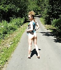 Teeny pissing in the middle of the country road