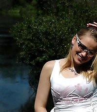 Playful little ho does water sports on lake shore