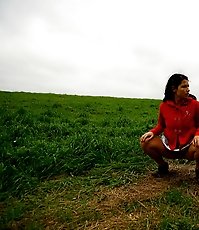 Girlie feeling cold takes a quick leak on a field