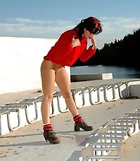 See a cute teen redhead pissing at the stadium