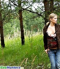 Blonde ho pissing in the middle of a country road