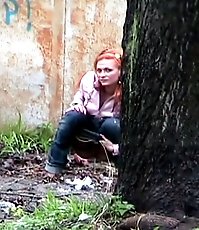 Hot girl with red hair filmed on the sly having a pee