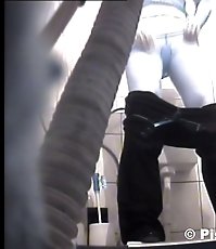 Voyeur peeps after two babes in public toilet