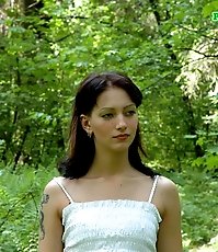 Gorgeous teeny sits down for a piss in the woods