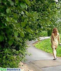Shameless blonde lass peeing onto the blacktop