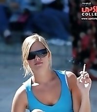 Smoking blonde in mini spyed, up skirt sitting