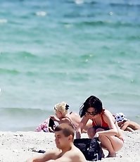 Girls on the beach wear nice bikinis