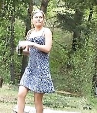 Cute teenage doll pees on a sun-drenched field