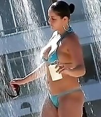 Cute bikini hotties are washing their delicious bodies under the pouring water streams