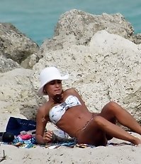 Spying cute bikini butts from behind