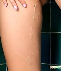 Girl opens ass while piddling in standing position