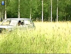 Girl peeing near the car