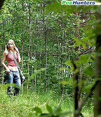 Blonde cutie empties her bladder in the forest
