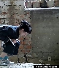 Awesome brunette emptying her overfilled bladder