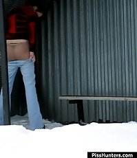 Winter shooting of a girl making water in the park