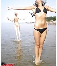 Lusty beach girls wearing hot sexy bikinis