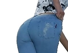 Blue fitting jeans of this girl sexily wrap her slim hips