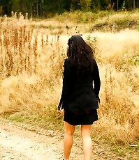 Beautiful brunette filmed pissing behind the bush