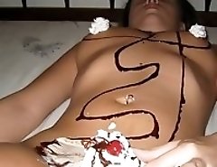 Young bimbo rubs pussy and gets covered with cream